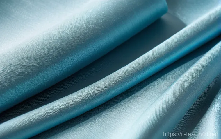 섬유기사 실기시험의 준비 사례 - **Prompt:** A detailed, close-up shot capturing the luxurious texture of a high-end silk and cashmer...